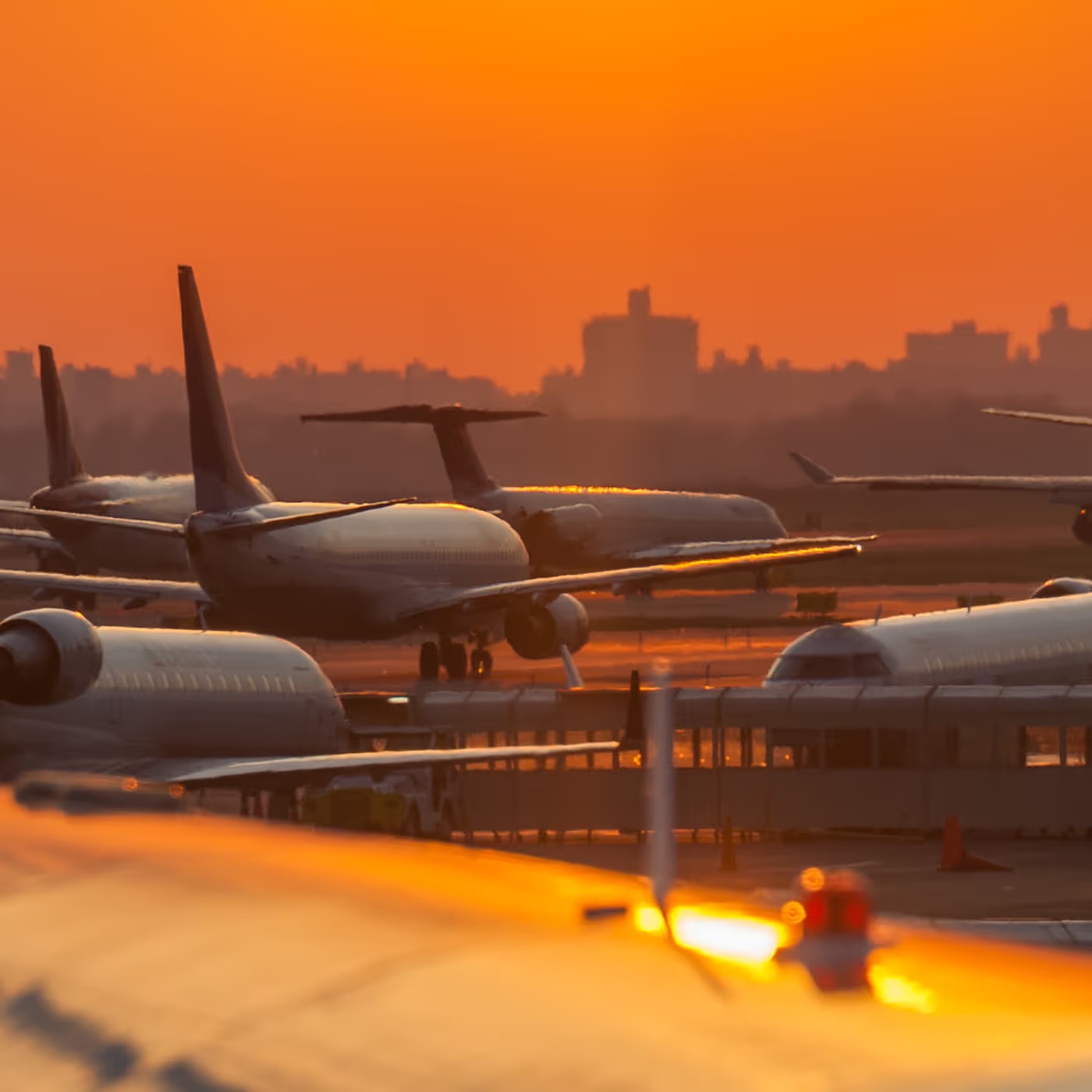 Passenger aircraft on the tarmac at sunset at an airport secured with facial authentication