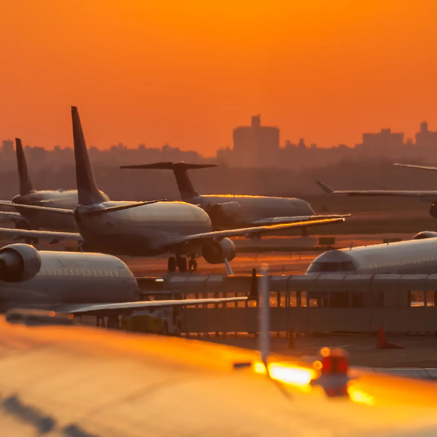Passenger aircraft on the tarmac at sunset at an airport secured with facial authentication